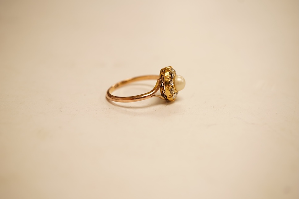An early 20th century 9ct, cultured pearl and rose cut diamond set circular cluster ring, size O, gross weight 2.8 grams.